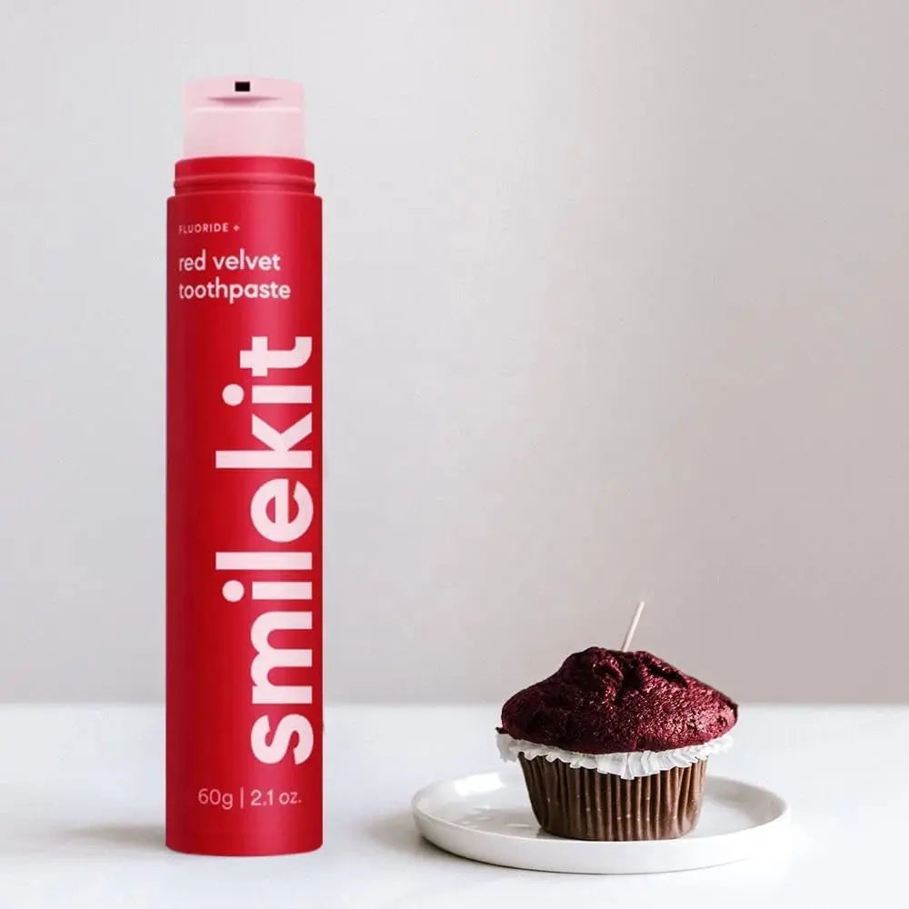 Smilekit red velvet toothpaste with cupcake on white plate.