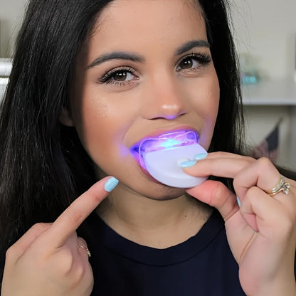 Woman using SMILEKIT Home Teeth Whitening Kit with LED light.