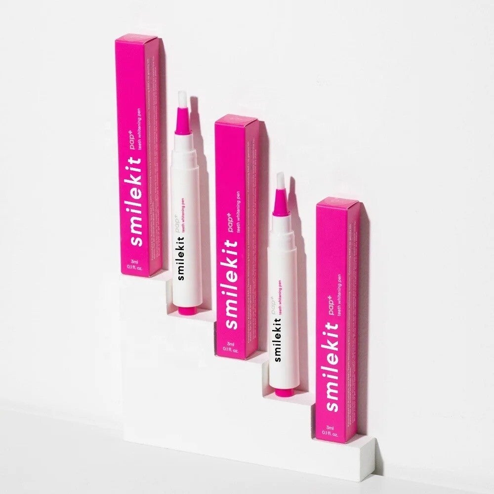 PAP+ Whitening Pen with pink packaging and applicator brush, designed for on-the-go teeth whitening.